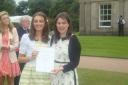 Alissa, left, collecting her Duke of Edinburgh Gold Award