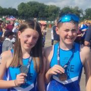 Twin atheletes Olivia and Charlie Lyne with their medals
