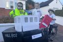 Iagan MacLeod, Charlotte Wilson and Danaidh Wilson dressed up as the ferry's 'skeleton crew'