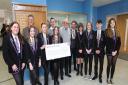 Social Justice Group pupils are pictured handing over the cheque to Pat Burke, middle, with head teacher Craig Gibson, left, Callum Edenborough, and Shaun Kavanagh.