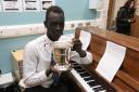 Piano prodigy Chol Riak who learned how to play the instrument using YouTube.