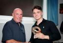 Tom Nicholson receives his award from Peter Robertson
