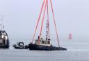 Sunken tug Biter recovered by crane barge Lara 1 off Greenock.