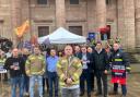 Fire fighters protesting swingeing service cuts stood shoulder to shoulder with elected officials ahead of a crunch meeting