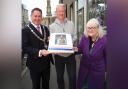 Aulds donate special cake to Greenock Burns Club ahead of their annual coffee morning
