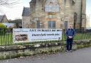 Inchgreen campaigner Alasdair Higgins with the banner at Old West Kirk shortly after its installation. (Image: Archive)