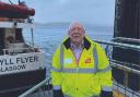 Dugie MacTaggart, pictured beside MV Argyll Flyer at CalMac's Gourock headquarters, was with the company for 48 years.