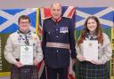 Lord Lieutenant Peter McCarthy presents awards to  Catriona Arkley and Aidan Phillips