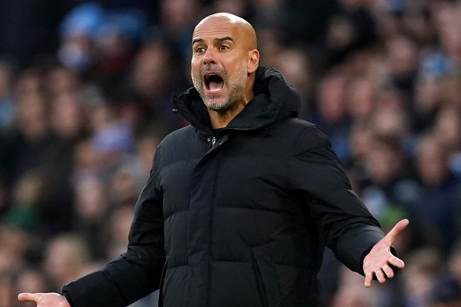 Pep Guardiola shouts on the touchline