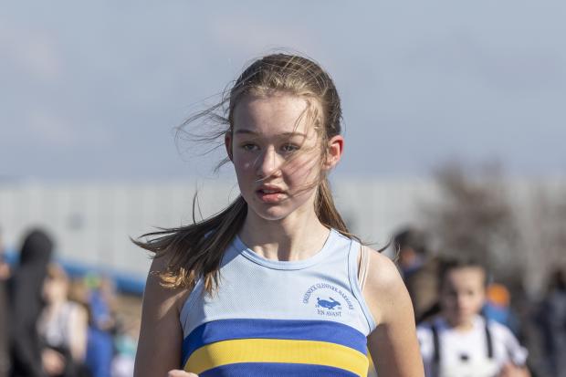 Scottish Athletics Young Athletes Road Race Championships at Battery Park, Greenock Hosted by Inverclyde Athletics Club 20th March 2022. Here the Glen Park runner is in blue yellow and with tartan Photographer Campbell Skinner