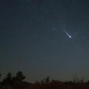 The Draconid meteor shower occurs when debris from comet Giacobini-Zinner burns up in the atmosphere.