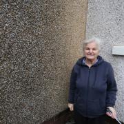 Helen McGoldrick is concerned that discoloured cladding will lead to dampness in her home