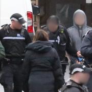 A dramatic ‘standoff’ unfolded yesterday morning as a large police presence surrounded a former Greenock care home before leading two men out in handcuffs.