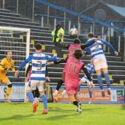 Robbie Muirhead rises above the Ayr United defence to power home Morton's opener in huge new year win