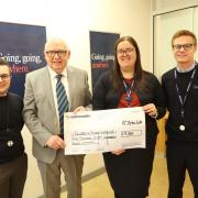 Children in Poverty Inverclyde founder Pat Burke, second from left, with William Ferguson, branch secretary, left, Sam Blair and Ryan Marciniak, both branch staff members.