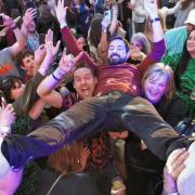 Martin Compston crowd surfs at Day Fever at Barras in Glasgow.