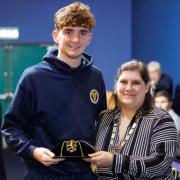 Owen Doyle is presented with Scotland cap by Gillian Duffy