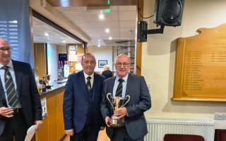 Whinhill Club Champion John Donald being presented the trophy by Club Captain David Siddons.