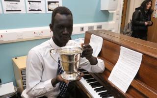 Piano prodigy Chol Riak who learned how to play the instrument using YouTube.